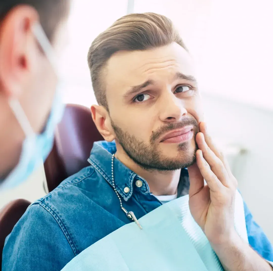 A person holding his chin