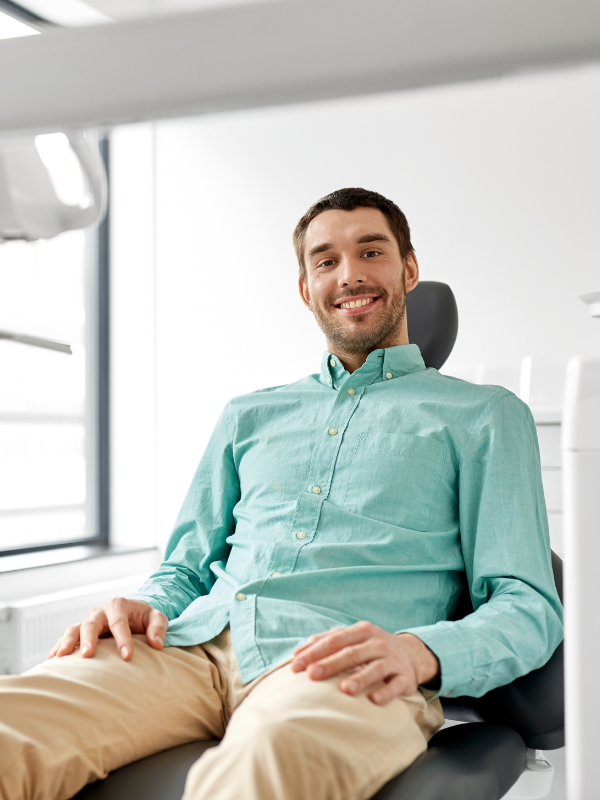 Dental filling patient smiling at Comprehensive Dental Care in Gainesville, FL