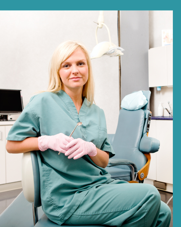 Dental hygienist working with patient